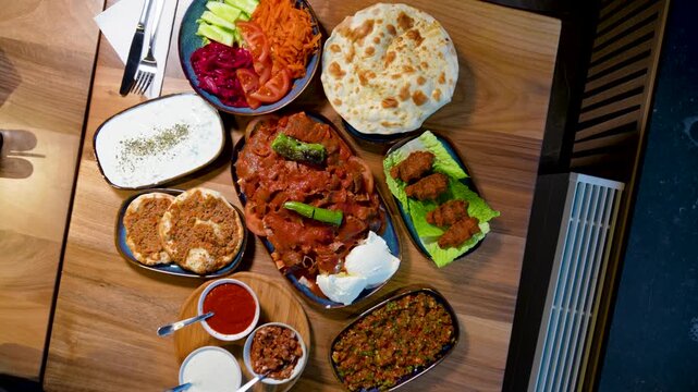 Full Turkish Family Feast Table with Traditional Food, Grilled Meat, Meze and Rustic Bread