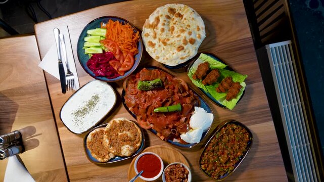 Full Turkish Family Feast Table with Traditional Food, Grilled Meat, Meze and Rustic Bread