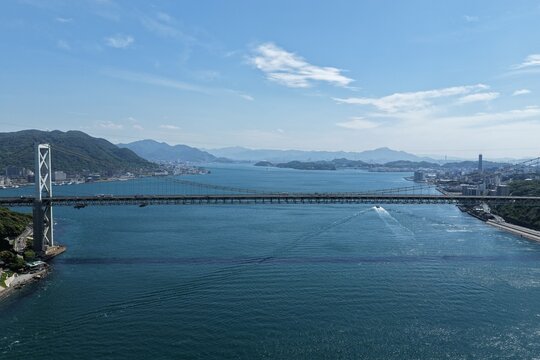 Aerial drone photo of Kanmon Bridge and Kanmon Strait, Shimonoseki and Moji, Japan