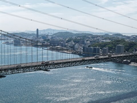 Aerial drone photo of Kanmon Bridge over Kanmon Strait, Shimonoseki and Moji, Japan