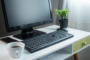 Fototapeta premium Modern home office desk with computer and coffee cup