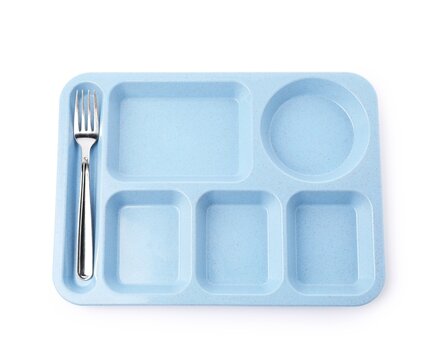 Blue plastic divided lunch tray with stainless steel fork on white background