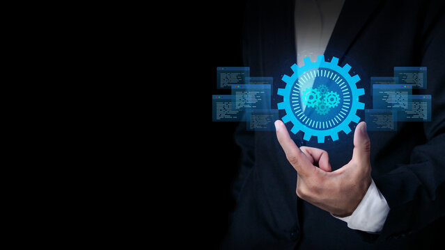 Digital Innovation in Action: A well-dressed individual delicately holds a glowing digital gear, symbolizing the power of technological innovation and its transformative impact.