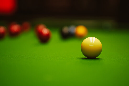 Snooker table with balls focused on white ball
