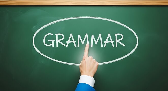 Finger pointing to the word Grammar on a green chalkboard in an oval frame.