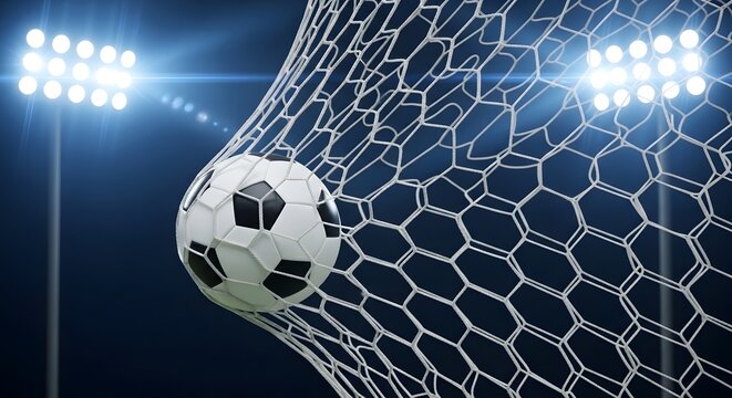 Soccer football goal ball entering net during match stadium lighting