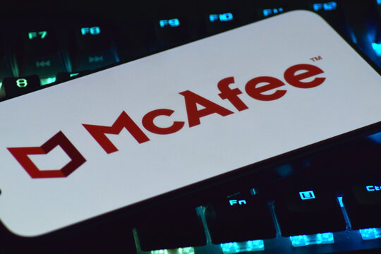 On a mobile phone screen logo McAfee Corp global computer security software company.