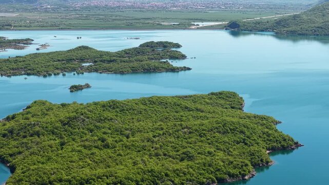 Drone Shot of Slano Lake Near Niksic, Montenegro. Artificial Water Reservoir With Islands and Pristine Landscape