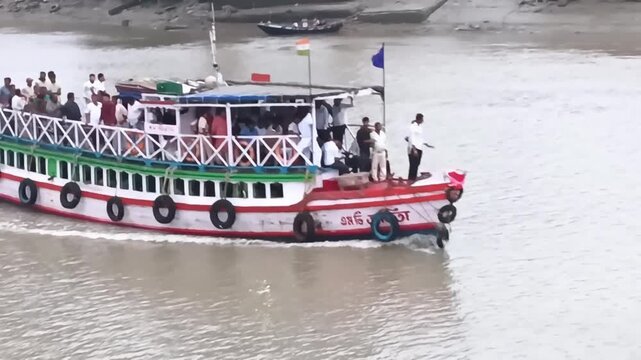 A crowded passenger ferry boat arriving at the terminal on the Hatania-Doania river.