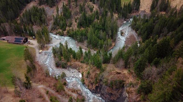 Aerial: establishing drone shot of river near Pochtenkessel deep rock funnel during the day near Adelboden, canton of Bern, Switzerland