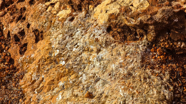 Close-up of natural crystalline quartz veins in reddish Mediterranean rock on Mallorca