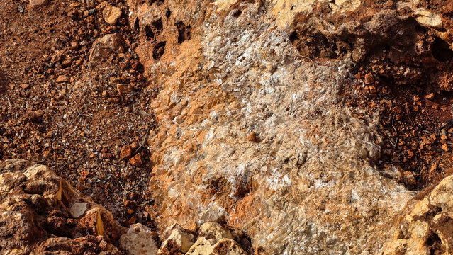 Close-up of natural crystalline quartz veins in reddish Mediterranean rock on Mallorca
