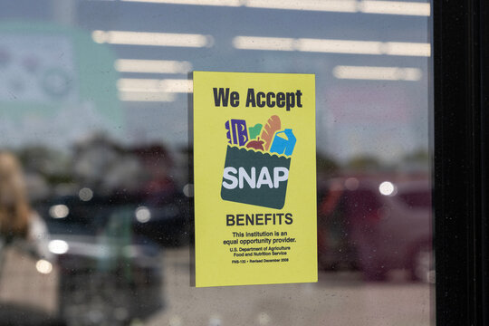 SNAP and EBT Accepted here sign. SNAP and Food Stamps provide benefits to help the budgets of disadvantaged families.