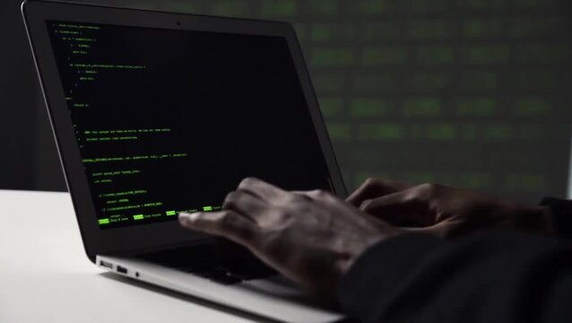 Close Up Hands of a Programmer Coding with Laptop Computer