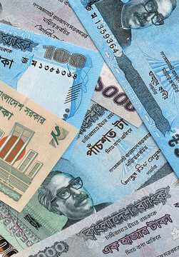 Bangladeshi taka money banknotes pile on table. Bangladesh bills of BDT currency close up