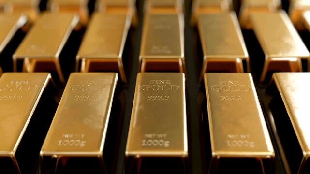Rows of shiny 1000g fine gold bars in a secure vault