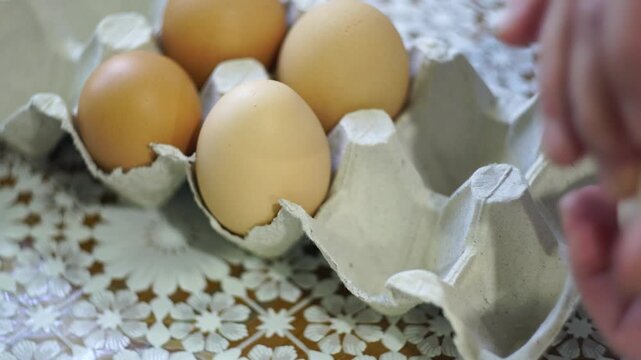 takes a few eggs from the package