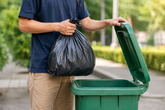 Man throwing garbage into the trash
