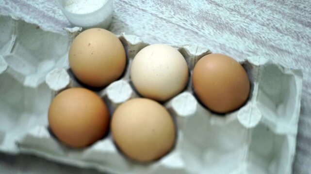 takes a few eggs from the package
