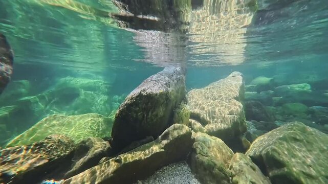 Spectacular images of the Torre River's whirlpools in Friuli. Above and below the water. The wild nature of the Julian Prealps.