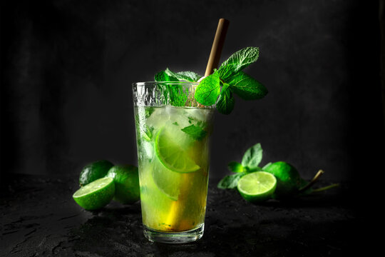 Mojito, summer cocktail with mint and ice, side view of a single glass