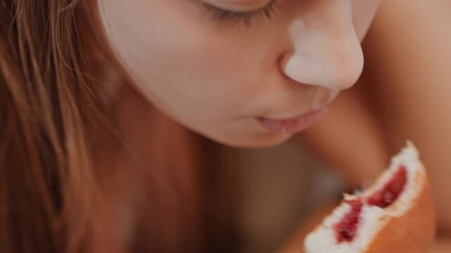 Teen with citrus. Teen quietly holding grapefruit slice during gentle morning routine. Calm youthful figure with citrus in hand experiencing serene morning backdrop with soft lighting