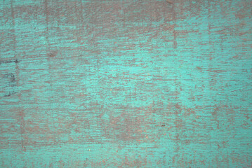 Fototapeta premium Green wooden planks with peeling paint and rough grain create a rustic, vintage textured background ideal for design, overlay, or editorial use emphasizing age, decay, and character.