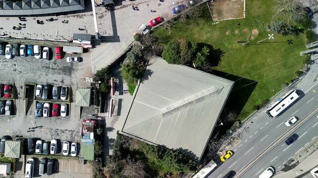Gondola lift station of Eyup Cable Car, over the roof drone rotation shot