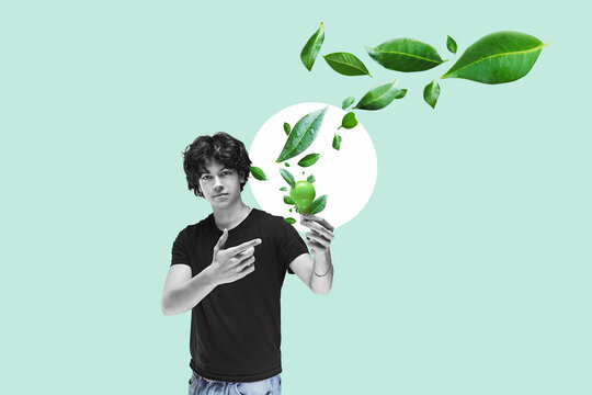 A young engineer holds a lightbulb with a flying green leaf. Sustainable green energy concept.