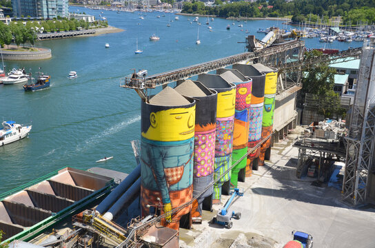 VANCOUVER BC CANADA: Ocean Concrete is Granville Island last tie to its industrial past, and now 6 concrete silos are being transformed by two famous Brazilian street artists Os Gemeos