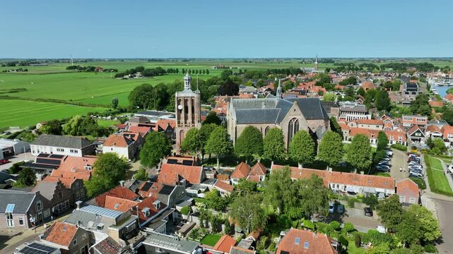 Historic canal town with prominent church tower in Europe