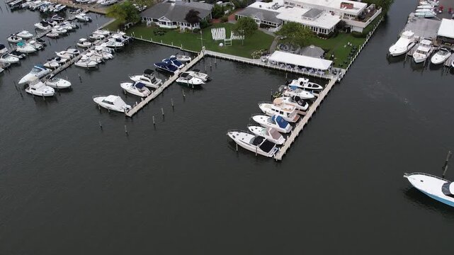 Aerial drone footage of Snapper Inn Waterfront Restaurant by the water during golden hour.