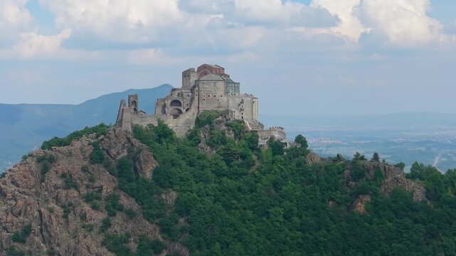 Epic Aerial Drone Orbit Around Sacra di San Michele at Sunset