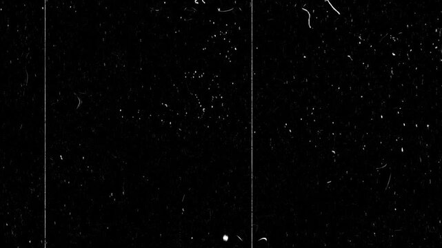 Vintage film grain overlay animation with cinematic dust scratches, retro movie texture effect, old projector background, black screen