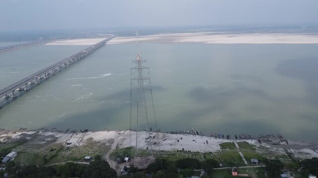 drone video clip of river barrage with moving vehicles on  bright sunny day in India