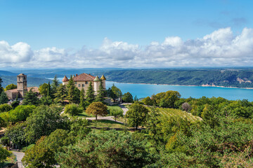 Fototapeta premium Aiguines castle, Chateau d Aiguines with St Croix lake in background, near Verdon gorge, Provence, France