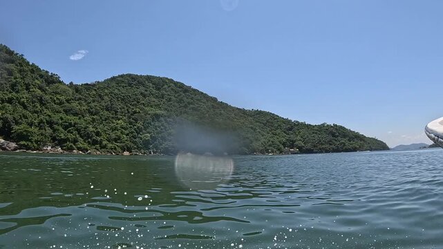 View of the sea and blue sky from inside the boat.