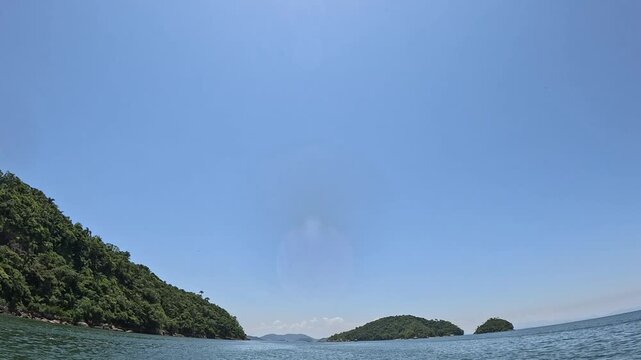 View of the sea and blue sky from inside the boat.