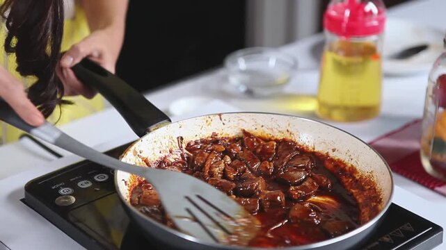 Cooking Beef Cubes with Rich Brown Gravy on Induction Cooktop.