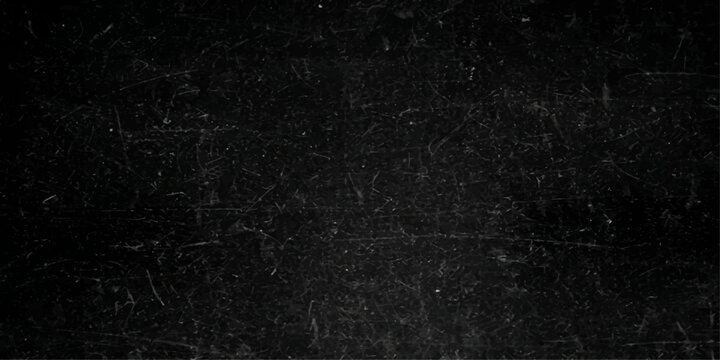 A dark, rough black chalkboard surface featuring a grunge stone texture and blank gray pattern creates an old, textured backdrop for a closeup wallpaper design