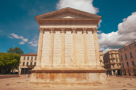 Hidden gems of France concept. Exterior of Maison Carree. Ancient Roman temple in Nimes. Outdoor shot. Sunny weather, cloudy sky