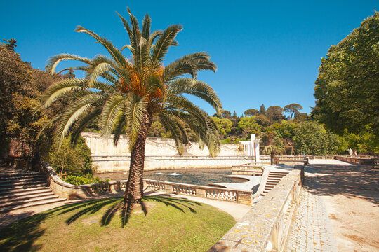 Hidden gems of France concept. A scenic view  of Jardins de la Fontaine, Nimes. Outdoor shot. Sunny weather.