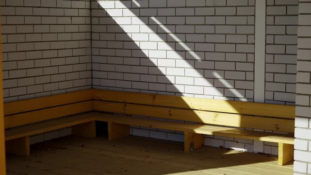 Spacious outdoor pavilion features brick walls and protective roof. Large open structure offers comfortable area for community gatherings
