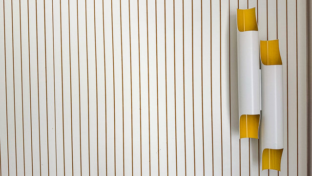 Modern Minimal Interior Wall With Vertical Wooden Slats And Contemporary Yellow Floor Lamps Copy Space