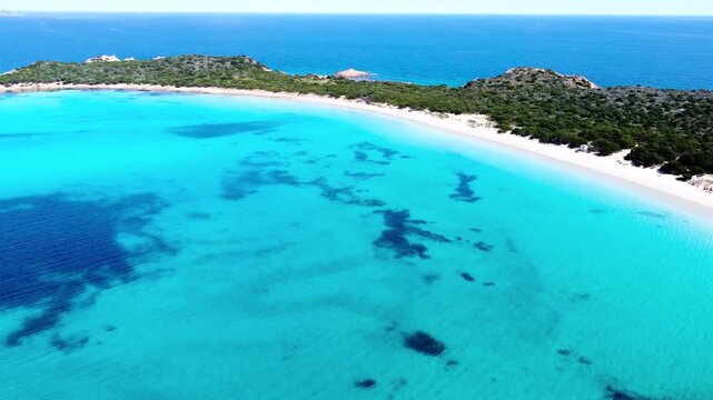 Aerial view of Capo Coda Cavallo sea and shoreline with turquoise water rocky coast and Mediterranean landscape in Sardinia on a sunny day