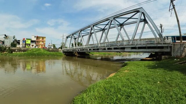 Polluted Ciliwung river with garbage in the slums of Jakarta, Indonesia.