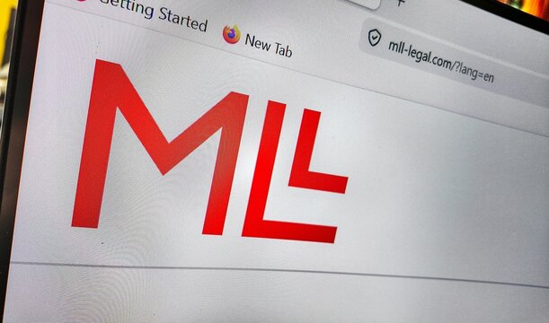 a computer screen with mll legal,swiss law firm website displayed