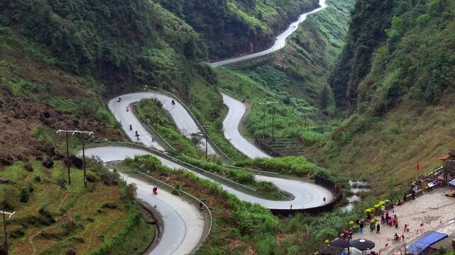 Aerial View Of the Winding Tham Ma Mountain Pass In Ha Giang Province In Vietnam - Ha Giang Loop Drone Shot at Sunset.