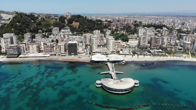 Durres city, Albania. Summer sunny day skyline. Aerial view with pier.