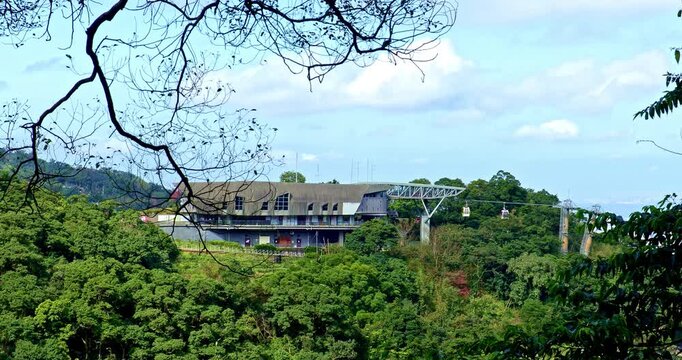 Panoramic views from the Taipei Maokong Gondola station nestled amidst lush green mountains and forests.